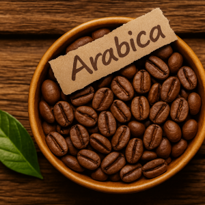 Organic Arabica coffee beans in a wooden bowl with a green leaf - whole roasted beans for brewing or natural scrubs.